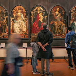 Visitors admiring a fresco in the Uffizi Galleries