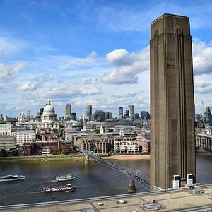 Skyline view of London from Tate Modern, featuring the Millennium Bridge and St. Paul’s Cathedral across the River Thames.